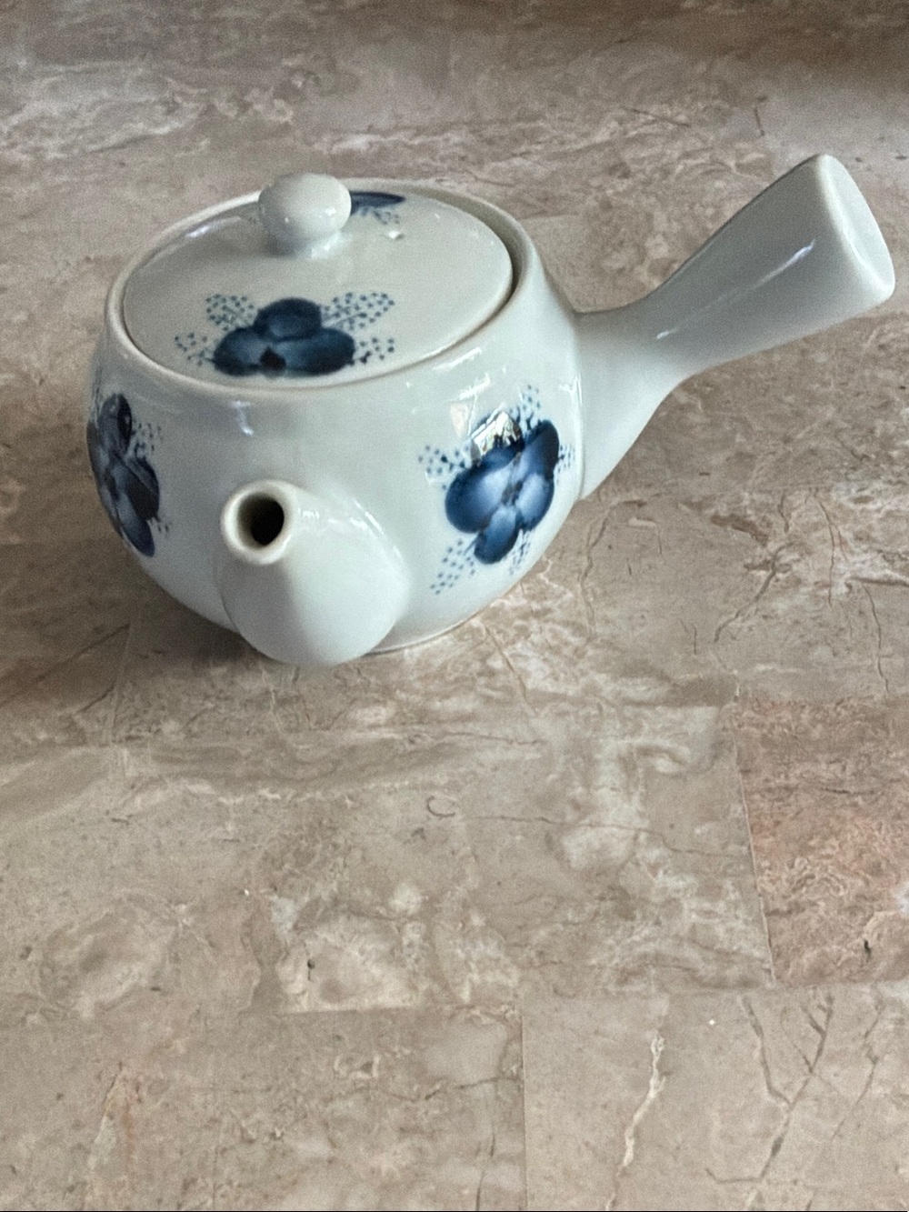 Classic White Ceramic Asian Teapot with Blue Floral Accents